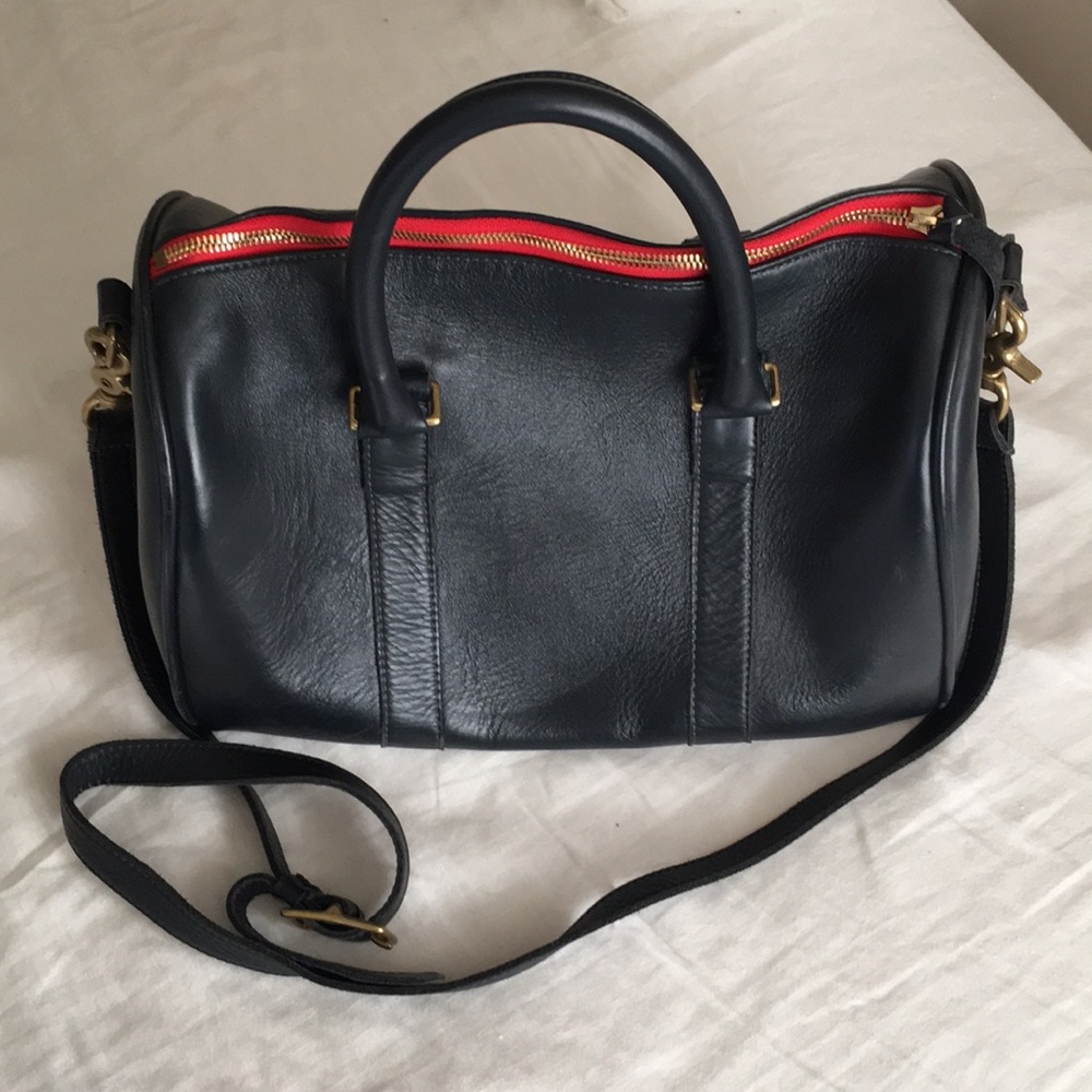 Clare Vivier navy satchel with red contrast zipper